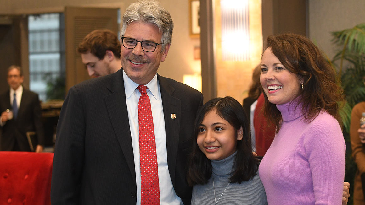 President Ken Gormley and Elizabeth Preate Havey, Esq., with a Duquesne student at the Civil Discourse 2023 event reception.