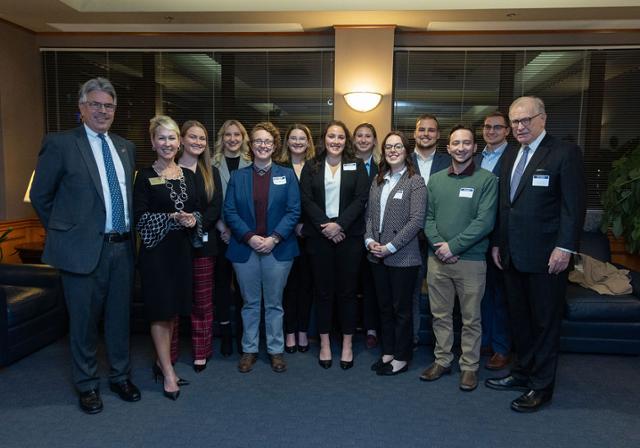 President Gormley, Dean Barton, and Jack McGinley with law students selected as 2022 McGinley Fellows. 