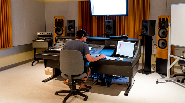 Student works in music technology studio.