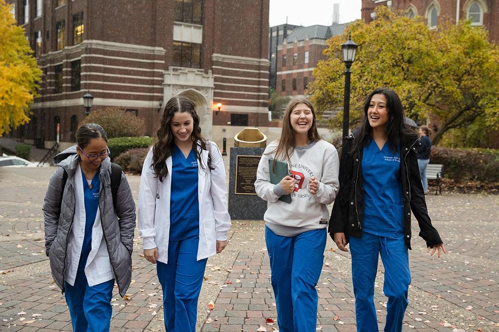 Nursing students walking on campus