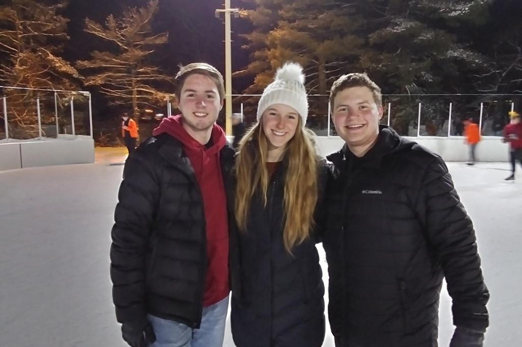 Three students at annual ice skating event