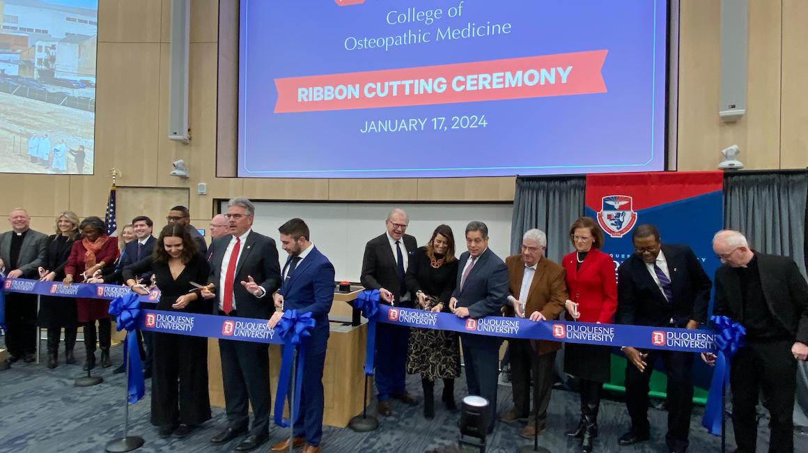 Attendees at ribbon-cutting ceremony