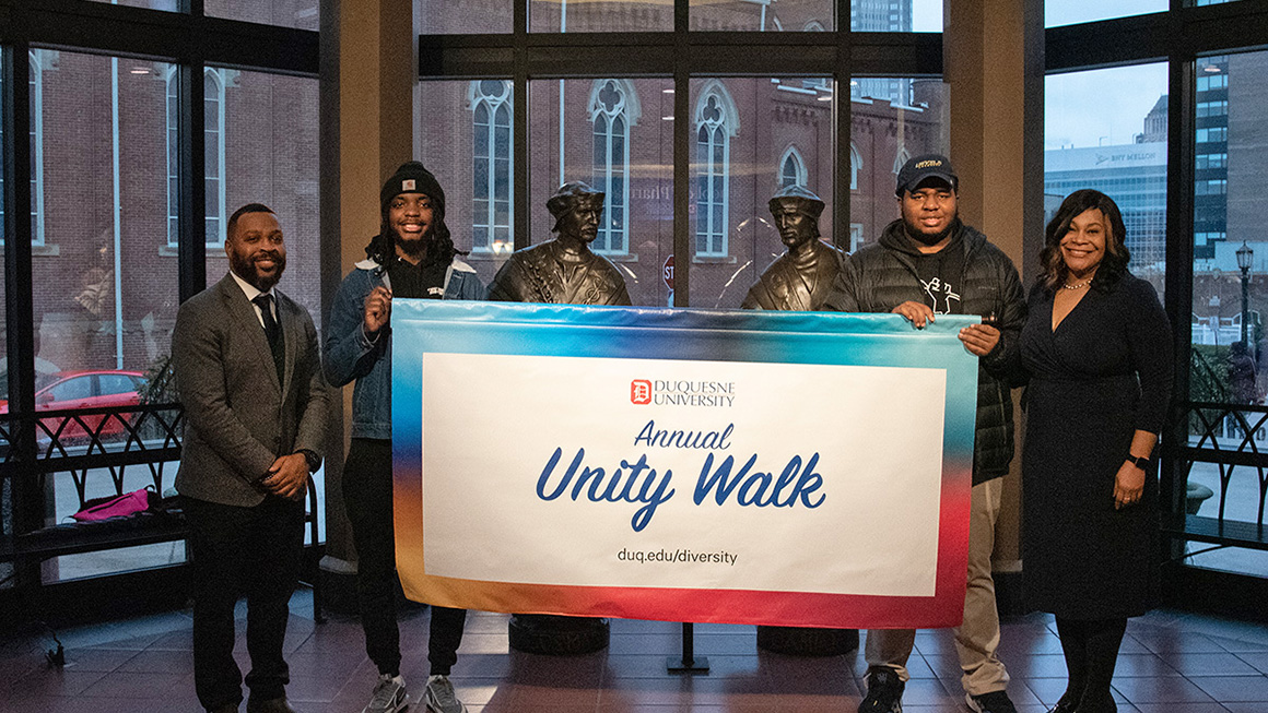 Leaders and participants engaged in the MLK 2023 Unity Walk at Duquesne University